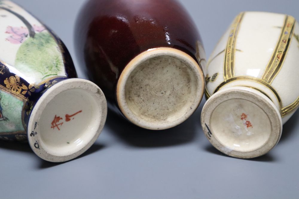 A Chinese deep red glazed jar and cover, 16cm, and two Satsuma vases